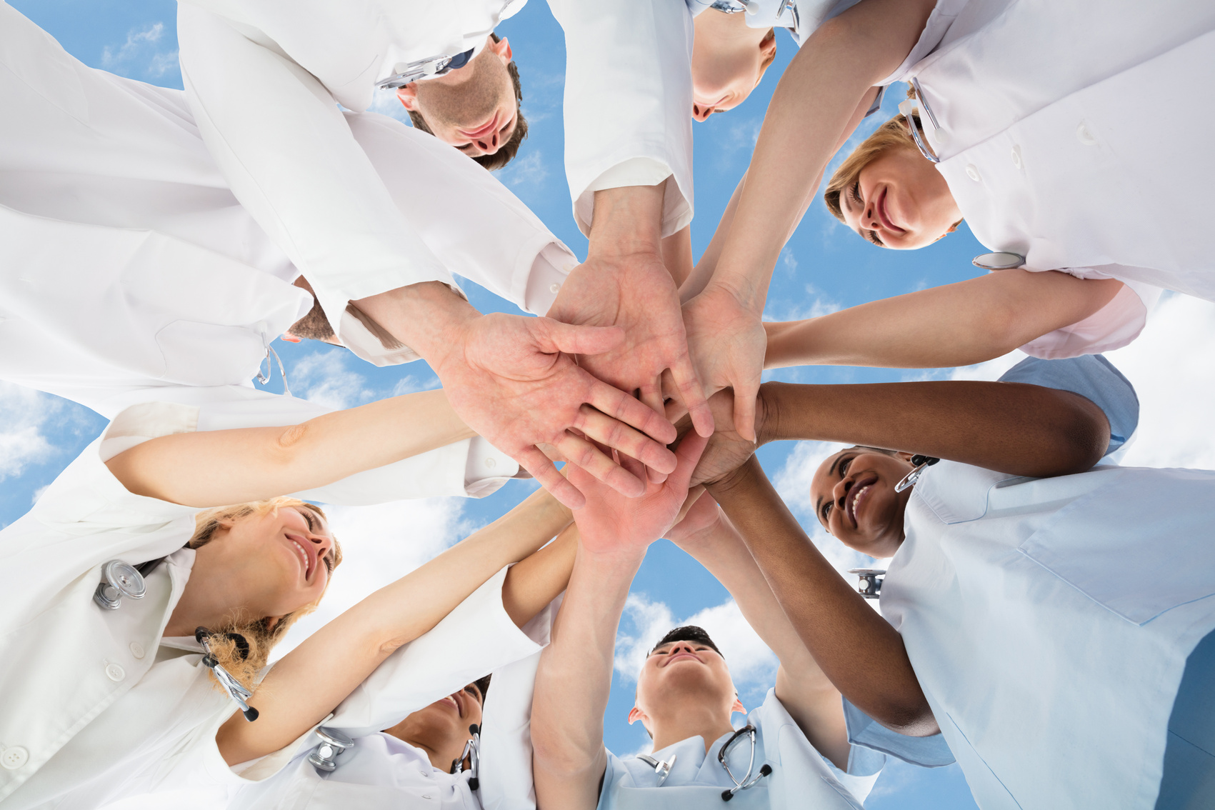 Smiling Medical Team Stacking Hands